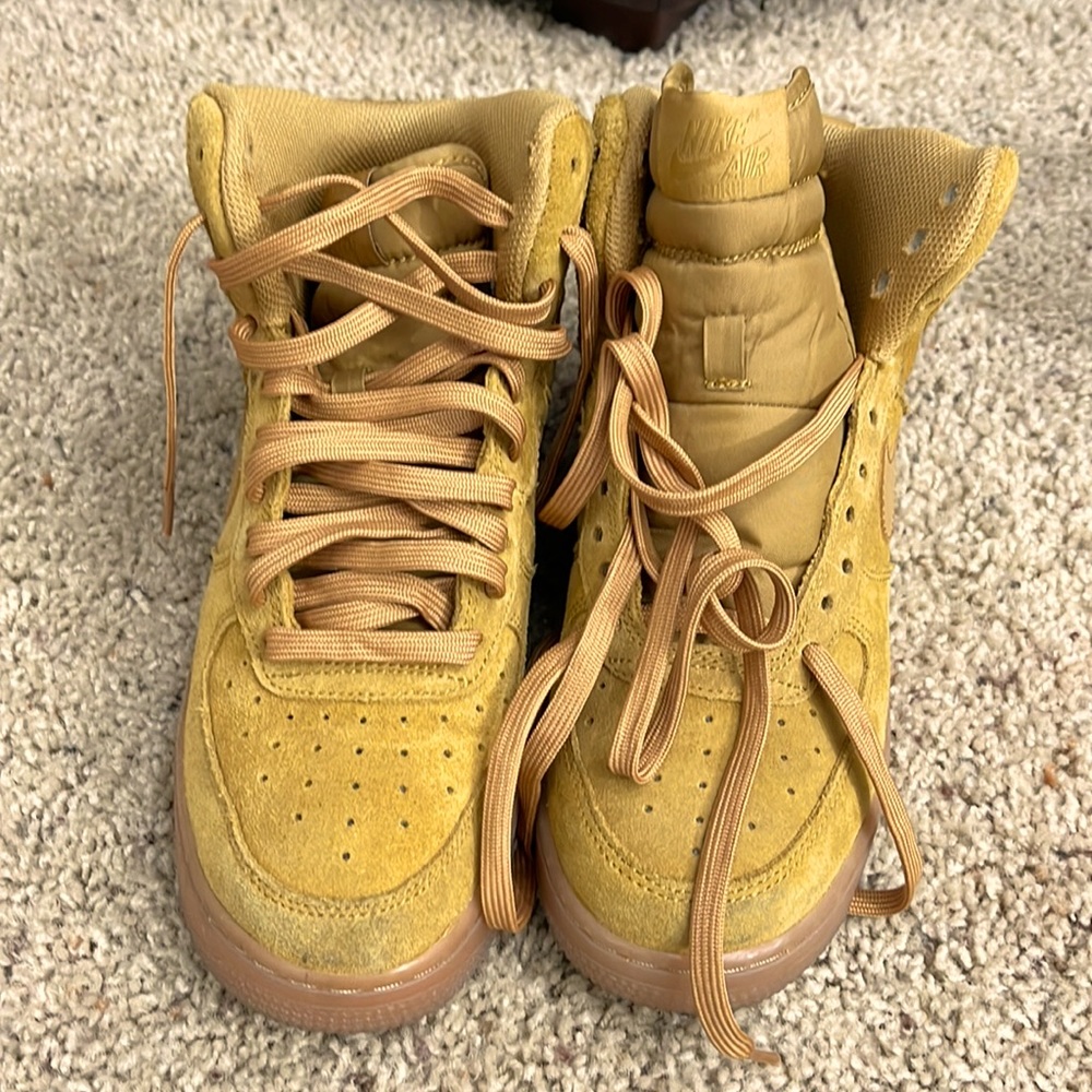 Mustard colored Nike high top shoes